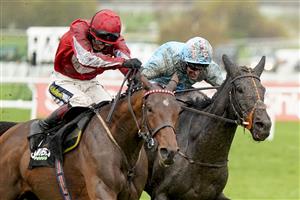 CHELTENHAM, ENGLAND - NOVEMBER 15: Robbie Power riding The Shunter (R) clear the last to win The Unibet Greatwood Handicap Hurdle at Cheltenham Racecourse on November 15, 2020 in Cheltenham, England. Owners are allowed to attend if they have a runner at the meeting otherwise racing remains behind closed doors to the public due to the Coronavirus pandemic. (Photo by Alan Crowhurst/Getty Images)