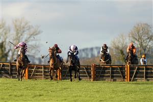 WINCANTON, ENGLAND - NOVEMBER 19: Tom Bellamy riding Dollnamix (L) clear the last to win The Watch Irish Racing On RacingTV Handicap Hurdle at Wincanton Racecourse on November 19, 2020 in Wincanton, England. Owners are allowed to attend if they have a runner at the meeting otherwise racing remains behind closed doors to the public due to the Coronavirus pandemic. (Photo by Alan Crowhurst/Getty Images)