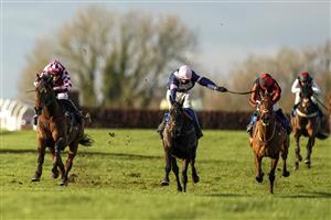 WINCANTON, ENGLAND - NOVEMBER 19: Tom Bellamy riding Dollnamix (L) clear the last to win The Watch Irish Racing On RacingTV Handicap Hurdle at Wincanton Racecourse on November 19, 2020 in Wincanton, England. Owners are allowed to attend if they have a runner at the meeting otherwise racing remains behind closed doors to the public due to the Coronavirus pandemic. (Photo by Alan Crowhurst/Getty Images)