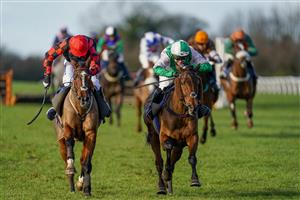 WINCANTON, ENGLAND - NOVEMBER 19: Jonjo O'Neill Jr riding Cary's Commodity (pink/green) clear the last to win The Join Racing TV Now Handicap Hurdle at Wincanton Racecourse on November 19, 2020 in Wincanton, England. Owners are allowed to attend if they have a runner at the meeting otherwise racing remains behind closed doors to the public due to the Coronavirus pandemic. (Photo by Alan Crowhurst/Getty Images)