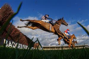 WINCANTON, ENGLAND - NOVEMBER 19: A general view as a runner clears a fence at Wincanton Racecourse on November 19, 2020 in Wincanton, England. Owners are allowed to attend if they have a runner at the meeting otherwise racing remains behind closed doors to the public due to the Coronavirus pandemic. (Photo by Alan Crowhurst/Getty Images)