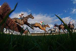 WINCANTON, ENGLAND - NOVEMBER 19: Rex Dingle riding Native Robin (L) on their way to winning The Racing TV HD On Sky 426 Handicap Chase at Wincanton Racecourse on November 19, 2020 in Wincanton, England. Owners are allowed to attend if they have a runner at the meeting otherwise racing remains behind closed doors to the public due to the Coronavirus pandemic. (Photo by Alan Crowhurst/Getty Images)