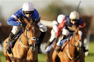 WINCANTON, ENGLAND - NOVEMBER 19: Harry Cobden riding Tamaroc De Mathan (blue/pink) clear the last to win The Visit racingtv.com Novices' Limited Handicap Chase at Wincanton Racecourse on November 19, 2020 in Wincanton, England. Owners are allowed to attend if they have a runner at the meeting otherwise racing remains behind closed doors to the public due to the Coronavirus pandemic. (Photo by Alan Crowhurst/Getty Images)