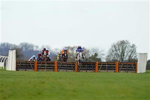 WINCANTON, ENGLAND - NOVEMBER 19: Harry Cobden riding Zyon (blue/pink) clear the last to win The Lenny Roberts Memorial Trophy Novices' Hurdle (GBB Race) (Div 2) at Wincanton Racecourse on November 19, 2020 in Wincanton, England. Owners are allowed to attend if they have a runner at the meeting otherwise racing remains behind closed doors to the public due to the Coronavirus pandemic. (Photo by Alan Crowhurst/Getty Images)