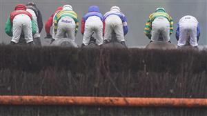 ASCOT, ENGLAND - NOVEMBER 20: A general view as runners clear a fence during The Watch Racing Free Online At Coral Handicap Chase at Ascot Racecourse on November 20, 2020 in Ascot, England. Owners are allowed to attend if they have a runner at the meeting otherwise racing remains behind closed doors to the public due to the Coronavirus pandemic. (Photo by Alan Crowhurst/Getty Images)