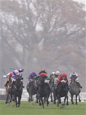 ASCOT, ENGLAND - NOVEMBER 20: Jonjo O'Neill riding Quarenta (C, green/red) clear the last to win The Watch Racing Free Online At Coral Handicap Chase at Ascot Racecourse on November 20, 2020 in Ascot, England. Owners are allowed to attend if they have a runner at the meeting otherwise racing remains behind closed doors to the public due to the Coronavirus pandemic. (Photo by Alan Crowhurst/Getty Images)