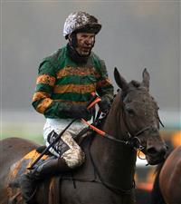 MANCHESTER, ENGLAND - NOVEMBER 21: A muddy Aidan Coleman aboard Collooney at Haydock Park, Merseyside on November 21, 2020 in Manchester, England. (Photo by Mike Egerton - Pool/Getty Images)