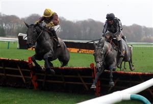 MANCHESTER, ENGLAND - NOVEMBER 21: War Lord ridden by Robbie Power (right) on their way to winning the Betfair Racing Only Bettor Handicap Hurdle ahead of Umbrigado at Haydock Park, Merseyside on November 21, 2020 in Manchester, England. (Photo by Mike Egerton - Pool/Getty Images)