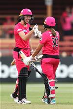 SYDNEY, AUSTRALIA - NOVEMBER 22: Lisa Griffith of the Sixers and Angela Reakes of the Sixers celebrate winning the Women's Big Bash League WBBL match between the Melbourne Stars and the Sydney Sixers at North Sydney Oval, on November 22, 2020, in Sydney, Australia. (Photo by Cameron Spencer/Getty Images)