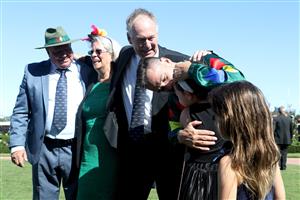 MELBOURNE, AUSTRALIA - FEBRUARY 29: Ryan Maloney celebrates with his children after riding Alligator Blood to victory in Race 7 the Kennedy Australian Guineas during Melbourne Racing at Flemington Racecourse on February 29, 2020 in Melbourne, Australia. (Photo by Jack Thomas/Getty Images)