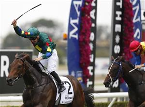 GOLD COAST, AUSTRALIA - JANUARY 11: Ryan Maloney rides Alligator Blood to victory int he $2 Milion Gold Coast Magic Millions 3YO Guineas race during the 2019 Magic Millions at the Gold Coast Turf Club on January 11, 2020 in Gold Coast, Australia. (Photo by Regi Varghese/Getty Images)