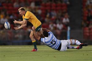 NEWCASTLE, AUSTRALIA - NOVEMBER 21: Reece Hodge of the Wallabies is tackled by Matias Alemanno of the Pumas during the 2020 Tri-Nations match between the Australian Wallabies and the Argentina Pumas at McDonald Jones Stadium on November 21, 2020 in Newcastle, Australia. (Photo by Mark Metcalfe/Getty Images)