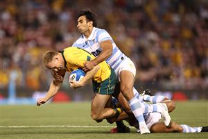 NEWCASTLE, AUSTRALIA - NOVEMBER 21: Reece Hodge of Australia is tackled during the 2020 Tri-Nations match between the Australian Wallabies and the Argentina Pumas at McDonald Jones Stadium on November 21, 2020 in Newcastle, Australia. (Photo by Cameron Spencer/Getty Images)