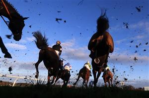 WETHERBY, UNITED KINGDOM - NOVEMBER 25: Runners and riders clear a fence during the Watch The Jumps In HD On RacingTV Handicap Chase at Wetherby Racecourse on November 25, 2020 in Wetherby, England. (Photo by Mike Egerton - Pool/Getty Images)
