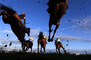 WETHERBY, UNITED KINGDOM - NOVEMBER 25: Runners and riders clear a fence during the Watch The Jumps In HD On RacingTV Handicap Chase at Wetherby Racecourse on November 25, 2020 in Wetherby, England. (Photo by Mike Egerton - Pool/Getty Images)