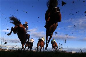 WETHERBY, UNITED KINGDOM - NOVEMBER 25: Runners and riders clear a fence during the Watch The Jumps In HD On RacingTV Handicap Chase at Wetherby Racecourse on November 25, 2020 in Wetherby, England. (Photo by Mike Egerton - Pool/Getty Images)
