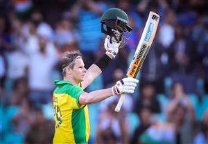 Australias Steve Smith celebrates reaching his century during the one-day international cricket match against India at the Sydney Cricket Ground (SCG) in Sydney on November 27, 2020. (Photo by DAVID GRAY / AFP) / IMAGE RESTRICTED TO EDITORIAL USE - STRICTLY NO COMMERCIAL USE (Photo by DAVID GRAY/AFP via Getty Images)