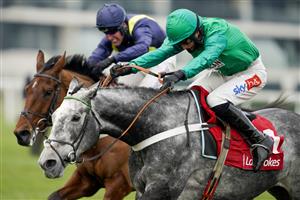NEWBURY, ENGLAND - NOVEMBER 27: Daryl Jacob riding Caribean Boy (green) clear the last to win The Ladbrokes Committed To Safer Gambling Novices' Chase at Newbury Racecourse on November 27, 2020 in Newbury, England. Owners are allowed to attend if they have a runner at the meeting otherwise racing remains behind closed doors to the public due to the Coronavirus pandemic. (Photo by Alan Crowhurst/Getty Images)