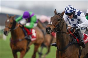 NEWBURY, ENGLAND - NOVEMBER 27: Jonathan Burke riding Clondaw Castle (check) clear the last to win The Get Your Ladbrokes 1 Free Bet Today Handicap Chase at Newbury Racecourse on November 27, 2020 in Newbury, England. Owners are allowed to attend if they have a runner at the meeting otherwise racing remains behind closed doors to the public due to the Coronavirus pandemic. (Photo by Alan Crowhurst/Getty Images)