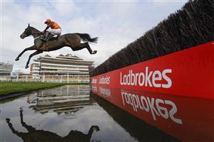 NEWBURY, ENGLAND - NOVEMBER 27: Sam Waley-Cohen riding Elusive Belle clear the water jump before going on to win The Ladbrokes Daily Odds Boosts Chase at Newbury Racecourse on November 27, 2020 in Newbury, England. Owners are allowed to attend if they have a runner at the meeting otherwise racing remains behind closed doors to the public due to the Coronavirus pandemic. (Photo by Alan Crowhurst/Getty Images)