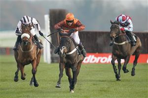 NEWBURY, ENGLAND - NOVEMBER 27: Sam Waley-Cohen riding Elusive Belle (orange/brown) clear the last to win The Ladbrokes Daily Odds Boosts Chase at Newbury Racecourse on November 27, 2020 in Newbury, England. Owners are allowed to attend if they have a runner at the meeting otherwise racing remains behind closed doors to the public due to the Coronavirus pandemic. (Photo by Alan Crowhurst/Getty Images)