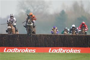 NEWBURY, ENGLAND - NOVEMBER 27: Sam Waley-Cohen riding Elusive Belle (orange/brown) clear the last to win The Ladbrokes Daily Odds Boosts Chase at Newbury Racecourse on November 27, 2020 in Newbury, England. Owners are allowed to attend if they have a runner at the meeting otherwise racing remains behind closed doors to the public due to the Coronavirus pandemic. (Photo by Alan Crowhurst/Getty Images)