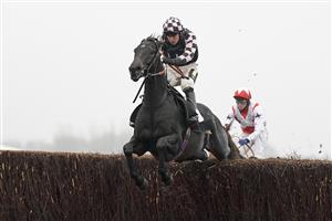 NEWBURY, ENGLAND - NOVEMBER 28: Jack Tudor riding Cap Du Nord clear the last to win The Sir Peter O'Sullevan Memorial Handicap Chase at Newbury Racecourse on November 28, 2020 in Newbury, England. Owners are allowed to attend if they have a runner at the meeting otherwise racing remains behind closed doors to the public due to the Coronavirus pandemic. (Photo by Alan Crowhurst/Getty Images)