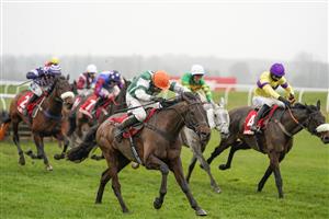 NEWBURY, ENGLAND - NOVEMBER 28: Harry Skelton riding Flash The Steel (orange cap) clear the last to win The Get Your Ladbrokes 1 Free Bet Today Handicap Hurdle at Newbury Racecourse on November 28, 2020 in Newbury, England. Owners are allowed to attend if they have a runner at the meeting otherwise racing remains behind closed doors to the public due to the Coronavirus pandemic. (Photo by Alan Crowhurst/Getty Images)
