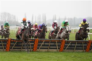 NEWBURY, ENGLAND - NOVEMBER 28: Harry Skelton riding Flash The Steel (orange cap) clear the last to win The Get Your Ladbrokes 1 Free Bet Today Handicap Hurdle at Newbury Racecourse on November 28, 2020 in Newbury, England. Owners are allowed to attend if they have a runner at the meeting otherwise racing remains behind closed doors to the public due to the Coronavirus pandemic. (Photo by Alan Crowhurst/Getty Images)