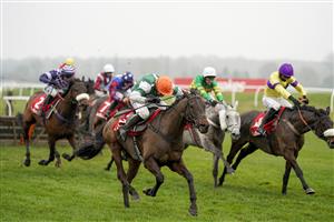NEWBURY, ENGLAND - NOVEMBER 28: Harry Skelton riding Flash The Steel (orange cap) clear the last to win The Get Your Ladbrokes 1 Free Bet Today Handicap Hurdle at Newbury Racecourse on November 28, 2020 in Newbury, England. Owners are allowed to attend if they have a runner at the meeting otherwise racing remains behind closed doors to the public due to the Coronavirus pandemic. (Photo by Alan Crowhurst/Getty Images)