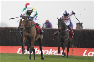 NEWBURY, ENGLAND - NOVEMBER 28: Tom Scudamore riding Cloth Cap (white cap) clear the last to win The Ladbrokes Trophy Chase at Newbury Racecourse on November 28, 2020 in Newbury, England. Owners are allowed to attend if they have a runner at the meeting otherwise racing remains behind closed doors to the public due to the Coronavirus pandemic. (Photo by Alan Crowhurst/Getty Images)