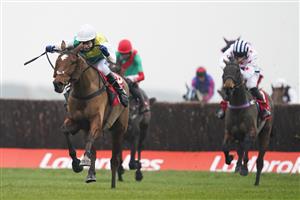 NEWBURY, ENGLAND - NOVEMBER 28: Tom Scudamore riding Cloth Cap (white cap) clear the last to win The Ladbrokes Trophy Chase at Newbury Racecourse on November 28, 2020 in Newbury, England. Owners are allowed to attend if they have a runner at the meeting otherwise racing remains behind closed doors to the public due to the Coronavirus pandemic. (Photo by Alan Crowhurst/Getty Images)