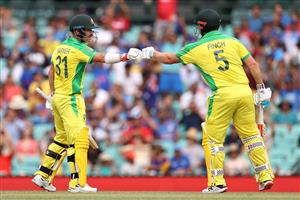 SYDNEY, AUSTRALIA - NOVEMBER 29: David Warner of Australia is congratulated by Aaron Finch of Australia after reaching 50 runs during game two of the One Day International series between Australia and India at Sydney Cricket Ground on November 29, 2020 in Sydney, Australia. (Photo by Cameron Spencer/Getty Images)