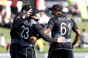 TAURANGA, NEW ZEALAND - NOVEMBER 29: Isa Sodhi of New Zealand congatulates Glenn Phillips on his catch of Kyle Mayers of the West Indies during game two of the International Twenty20 series between New Zealand and the West Indies at Bay Oval on November 29, 2020 in Tauranga, New Zealand. (Photo by Phil Walter/Getty Images)