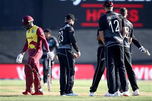 TAURANGA, NEW ZEALAND - NOVEMBER 29: Fabian Allen of the West Indies (L) leaves the field after being caught by Glenn Phillips of New Zealand during game two of the International Twenty20 series between New Zealand and the West Indies at Bay Oval on November 29, 2020 in Tauranga, New Zealand. (Photo by Phil Walter/Getty Images)