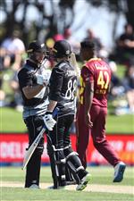 TAURANGA, NEW ZEALAND - NOVEMBER 29: Glenn Phillips of New Zealand (L) celebrates his century with Devon Conway of New Zealand (R) during game two of the International Twenty20 series between New Zealand and the West Indies at Bay Oval on November 29, 2020 in Tauranga, New Zealand. (Photo by Phil Walter/Getty Images)