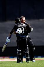 TAURANGA, NEW ZEALAND - NOVEMBER 29: Glenn Phillips of New Zealand (R) celebrates his century with Devon Conway of New Zealand during game two of the International Twenty20 series between New Zealand and the West Indies at Bay Oval on November 29, 2020 in Tauranga, New Zealand. (Photo by Phil Walter/Getty Images)