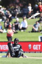 TAURANGA, NEW ZEALAND - NOVEMBER 29: Glenn Phillips of New Zealand looses his bat as he falls to the ground with an injury during game two of the International Twenty20 series between New Zealand and the West Indies at Bay Oval on November 29, 2020 in Tauranga, New Zealand. (Photo by Phil Walter/Getty Images)