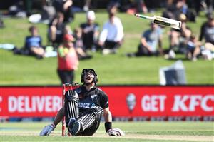TAURANGA, NEW ZEALAND - NOVEMBER 29: Glenn Phillips of New Zealand looses his bat as he falls to the ground with an injury during game two of the International Twenty20 series between New Zealand and the West Indies at Bay Oval on November 29, 2020 in Tauranga, New Zealand. (Photo by Phil Walter/Getty Images)
