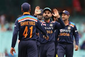 SYDNEY, AUSTRALIA - NOVEMBER 29: Shreyas Iyer of India is congratulated by Virat Kohli of India after running out David Warner of Australia during game two of the One Day International series between Australia and India at Sydney Cricket Ground on November 29, 2020 in Sydney, Australia. (Photo by Cameron Spencer/Getty Images)