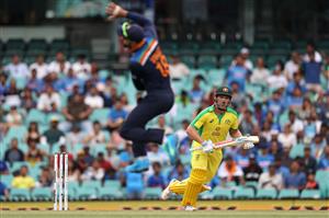SYDNEY, AUSTRALIA - NOVEMBER 29: Virat Kohli of India jumps for a ball as Aaron Finch of Australia bats during game two of the One Day International series between Australia and India at Sydney Cricket Ground on November 29, 2020 in Sydney, Australia. (Photo by Cameron Spencer/Getty Images)