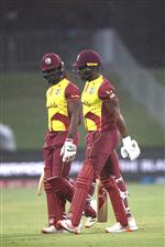 TAURANGA, NEW ZEALAND - NOVEMBER 30: Andre Fletcher and Kyle Mayers of the West Indies leave the field with a rain delay during game three of the International Twenty20 series between New Zealand and the West Indies at Bay Oval on November 30, 2020 in Tauranga, New Zealand. (Photo by Phil Walter/Getty Images)