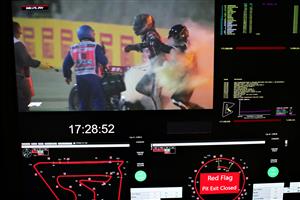 BAHRAIN, BAHRAIN - NOVEMBER 29: Romain Grosjean of France and Haas F1 is pictured on a screen escaping his crash during the F1 Grand Prix of Bahrain at Bahrain International Circuit on November 29, 2020 in Bahrain, Bahrain. (Photo by Peter Fox/Getty Images)