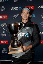 TAURANGA, NEW ZEALAND - NOVEMBER 30: Mitchell Santner of New Zealand poses with the T20 series trophy following game three of the International Twenty20 series between New Zealand and the West Indies at Bay Oval on November 30, 2020 in Tauranga, New Zealand. (Photo by Phil Walter/Getty Images)