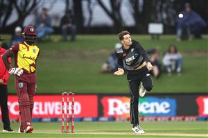 TAURANGA, NEW ZEALAND - NOVEMBER 30: Mitchell Santner of New Zealand bowls during game three of the International Twenty20 series between New Zealand and the West Indies at Bay Oval on November 30, 2020 in Tauranga, New Zealand. (Photo by Phil Walter/Getty Images)
