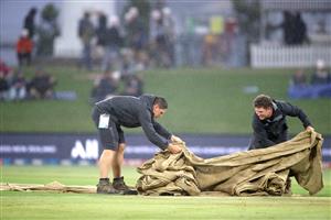TAURANGA, NEW ZEALAND - NOVEMBER 30: Rain forces the covers on during game three of the International Twenty20 series between New Zealand and the West Indies at Bay Oval on November 30, 2020 in Tauranga, New Zealand. (Photo by Phil Walter/Getty Images)