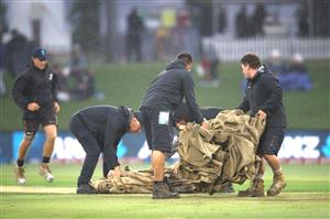 TAURANGA, NEW ZEALAND - NOVEMBER 30: Rain forces the covers on during game three of the International Twenty20 series between New Zealand and the West Indies at Bay Oval on November 30, 2020 in Tauranga, New Zealand. (Photo by Phil Walter/Getty Images)