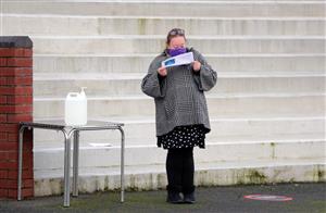 LUDLOW, ENGLAND - DECEMBER 02: A racegoer studies the form at Ludlow Racecourse on December 2, 2020 in Ludlow, England. (Photo by David Davies - Pool/Getty Images)