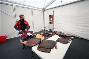 LUDLOW, ENGLAND - DECEMBER 02: Jockey Jonathan Burke prepares his saddle at Ludlow Racecourse on December 2, 2020 in Ludlow, England. (Photo by David Davies - Pool/Getty Images)