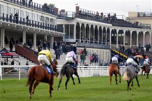 LUDLOW, ENGLAND - DECEMBER 02: Racegoers watch from the grand stand at Ludlow Racecourse on December 2, 2020 in Ludlow, England. (Photo by David Davies - Pool/Getty Images)